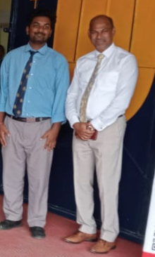 Two professionals at an indoor event in Ranchi